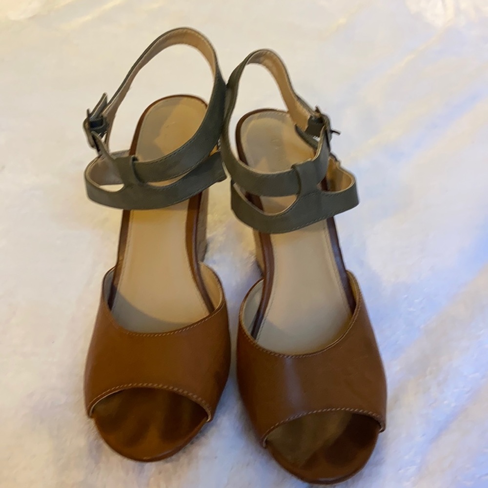 Such a unique wedge!  Grey straps with camel color shoe, and cork heel!